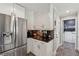 Modern kitchen features stainless fridge, stainless appliances, and bright, white cabinets at 1154 Pair Sw Rd, Marietta, GA 30060