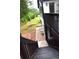 View of the home's backyard and newly installed deck with stairs, landscaping, and mature trees at 3211 Oaktree Park Dr, Lawrenceville, GA 30044