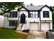 Charming two-story home featuring a well-manicured lawn and a two-car garage at 3211 Oaktree Park Dr, Lawrenceville, GA 30044