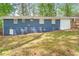 Back exterior view with a sloping lawn at 3901 Bonnie Se Ln, Atlanta, GA 30354
