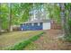 Backyard view with mature trees and grass at 3901 Bonnie Se Ln, Atlanta, GA 30354