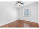 This bedroom has hardwood floors, updated paint, and a ceiling fan at 3901 Bonnie Se Ln, Atlanta, GA 30354