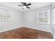 This bedroom has refinished hardwood floors, updated windows, and a ceiling fan at 3901 Bonnie Se Ln, Atlanta, GA 30354