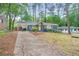 Charming exterior with a walkway, driveway, and well-maintained lawn at 3901 Bonnie Se Ln, Atlanta, GA 30354