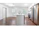 Modern kitchen with an island, stainless steel appliances, and dark hardwood floors at 3901 Bonnie Se Ln, Atlanta, GA 30354