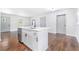 Updated kitchen with stainless steel dishwasher and island flowing seamlessly into the living area at 3901 Bonnie Se Ln, Atlanta, GA 30354