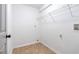 Clean laundry room with a wire shelf, neutral flooring, and ready for a washer and dryer at 3901 Bonnie Se Ln, Atlanta, GA 30354