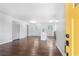 Bright living room featuring dark hardwood floors with view into the kitchen with a center island at 3901 Bonnie Se Ln, Atlanta, GA 30354