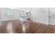 Inviting living room with hardwood floors, opening to a modern kitchen with stainless steel appliances at 3901 Bonnie Se Ln, Atlanta, GA 30354