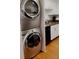 Laundry area featuring a new stackable washer and dryer and granite countertops at 2479 Peachtree Rd # 503, Atlanta, GA 30305