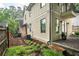Charming backyard featuring green grass, a patio area, and the exterior of the home with multiple windows at 2580 Acorn Ne Ave, Atlanta, GA 30305