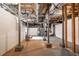 Spacious basement with support beams and concrete floors ready for personalization at 2580 Acorn Ne Ave, Atlanta, GA 30305