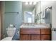 Bathroom featuring a neutral color scheme, vanity with granite countertop, modern fixtures, and framed mirror at 2580 Acorn Ne Ave, Atlanta, GA 30305