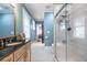 Bathroom boasts a glass enclosed shower, black and white tile floor, and vanity with granite top at 2580 Acorn Ne Ave, Atlanta, GA 30305