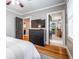 Bedroom with TV, dresser, walk-in closet, and ensuite bathroom at 2580 Acorn Ne Ave, Atlanta, GA 30305