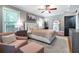 Bedroom features large bed, sitting area, windows, and an ensuite bathroom and closet at 2580 Acorn Ne Ave, Atlanta, GA 30305