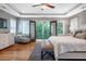 Main bedroom with hardwood floors, a balcony, windows, and a decorative ceiling at 2580 Acorn Ne Ave, Atlanta, GA 30305