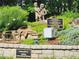 Sculpture memorial in Garden Hills with statues of children and a dedication plaque at 2580 Acorn Ne Ave, Atlanta, GA 30305