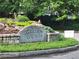 The historic Garden Hills community entrance is marked with stone signage and lush landscaping at 2580 Acorn Ne Ave, Atlanta, GA 30305