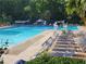 Large community pool with multiple lanes, surrounded by lounge chairs and lush greenery at 2580 Acorn Ne Ave, Atlanta, GA 30305