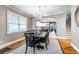 Elegant dining room with hardwood floors, a chandelier, and views of the modern white kitchen at 2580 Acorn Ne Ave, Atlanta, GA 30305