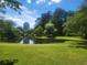 Scenic view of the Duck Pond, showcasing green spaces and a tranquil pond reflecting the sky at 2580 Acorn Ne Ave, Atlanta, GA 30305