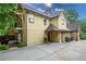 Side exterior of a two-story home with a driveway and a covered entryway leading to the front door at 2580 Acorn Ne Ave, Atlanta, GA 30305