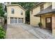 Exterior view of a detached garage and side entrance to the home with a concrete driveway at 2580 Acorn Ne Ave, Atlanta, GA 30305