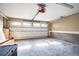 Spacious garage with a white door, concrete floors, and cinder block wall, perfect for storage at 2580 Acorn Ne Ave, Atlanta, GA 30305