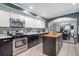 A kitchen featuring stainless steel appliances, contrasting cabinets, and a central island at 2580 Acorn Ne Ave, Atlanta, GA 30305