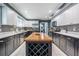 Bright kitchen featuring white and gray cabinetry, stainless steel appliances, and a butcher block island at 2580 Acorn Ne Ave, Atlanta, GA 30305
