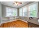 Sunlit office with built-in shelves, hardwood floors, and a large window offering views of the outdoors at 2580 Acorn Ne Ave, Atlanta, GA 30305