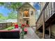 Inviting outdoor living space with a balcony above, perfect for relaxing and entertaining guests at 2580 Acorn Ne Ave, Atlanta, GA 30305