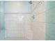 Walk-in shower with sleek tile, built-in bench, and glass enclosure, showcasing modern design and functionality at 2580 Acorn Ne Ave, Atlanta, GA 30305