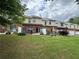 Townhome backyard featuring a patio and green lawn at 3871 Pleasant Oaks Dr, Lawrenceville, GA 30044