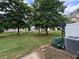 View of the spacious backyard with mature trees at 3871 Pleasant Oaks Dr, Lawrenceville, GA 30044