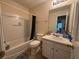 Standard bathroom featuring a vanity with storage, toilet, and shower/tub combo at 3871 Pleasant Oaks Dr, Lawrenceville, GA 30044