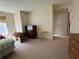 Bedroom with neutral carpet, dresser and natural light from the window at 3871 Pleasant Oaks Dr, Lawrenceville, GA 30044
