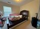 Bedroom features a carpeted floor, natural light, and furniture at 3871 Pleasant Oaks Dr, Lawrenceville, GA 30044