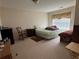 Bedroom featuring neutral carpet and a window allowing natural light at 3871 Pleasant Oaks Dr, Lawrenceville, GA 30044