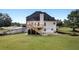 An exterior shot of the house showing the backyard with a two-story deck at 400 Kyle Ct, Fayetteville, GA 30215