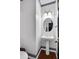 Powder room with pedestal sink, hardwood floors, and ample lighting at 400 Kyle Ct, Fayetteville, GA 30215