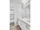 This bright bathroom features a double sink vanity with gold hardware and a shower at 400 Kyle Ct, Fayetteville, GA 30215