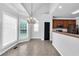 Bright dining area with stylish chandelier, large windows, and views of the backyard at 400 Kyle Ct, Fayetteville, GA 30215