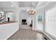 Bright dining area with chandelier, backyard access, and views into the living room at 400 Kyle Ct, Fayetteville, GA 30215