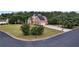 Charming brick home on a corner lot with a lush green lawn and mature trees at 400 Kyle Ct, Fayetteville, GA 30215