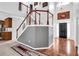 Bright entryway with hardwood floors, staircase, and elegant chandelier at 400 Kyle Ct, Fayetteville, GA 30215