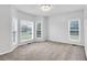 Inviting living room featuring large windows and neutral carpet at 400 Kyle Ct, Fayetteville, GA 30215