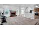 Spacious living room features a fireplace, kitchen access, and ample natural light at 400 Kyle Ct, Fayetteville, GA 30215