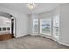 Bright living room featuring large windows and neutral carpet at 400 Kyle Ct, Fayetteville, GA 30215